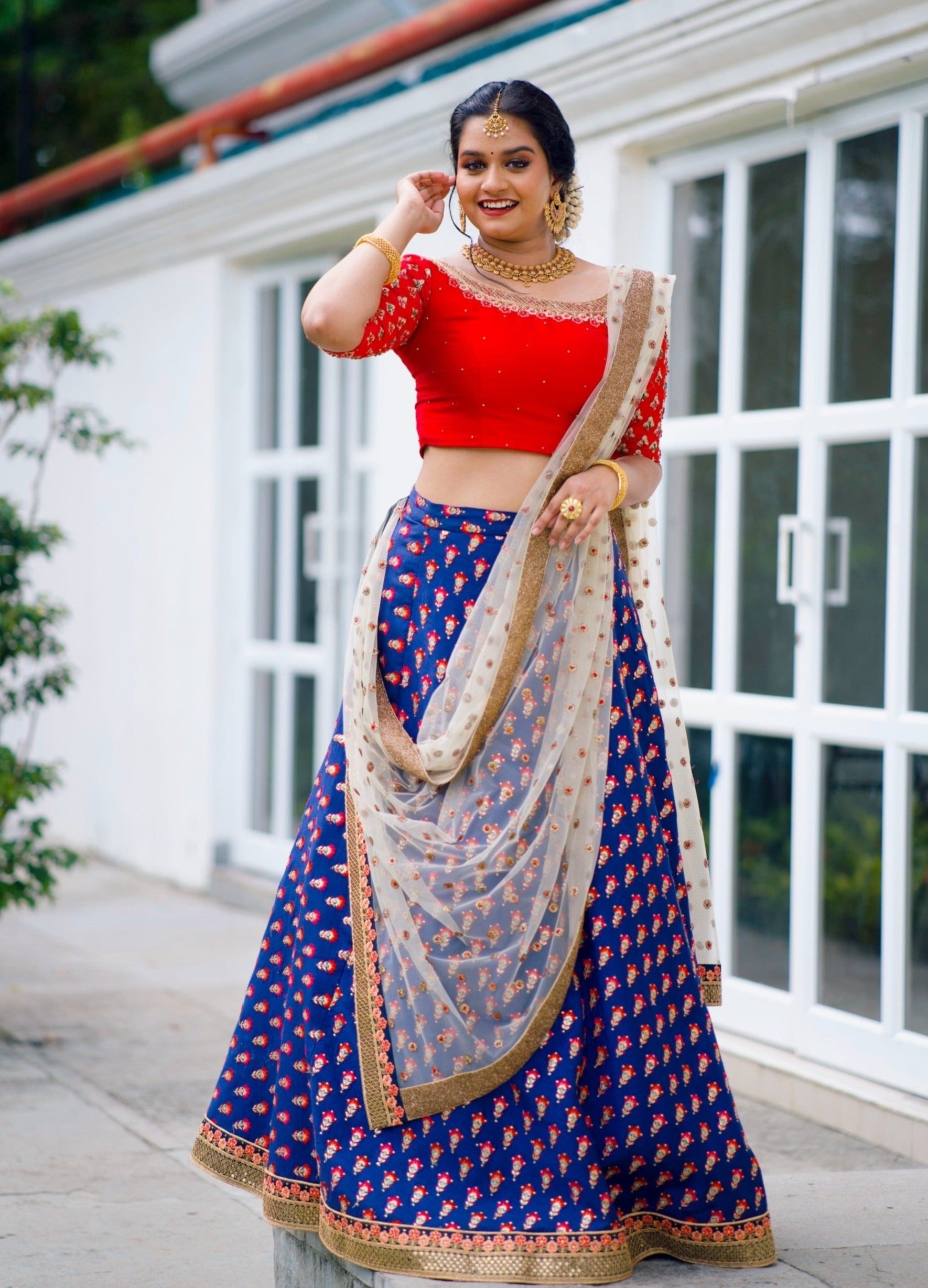 Red/ Blue Traditional Lehenga detailed with Golden Hand Embroidery