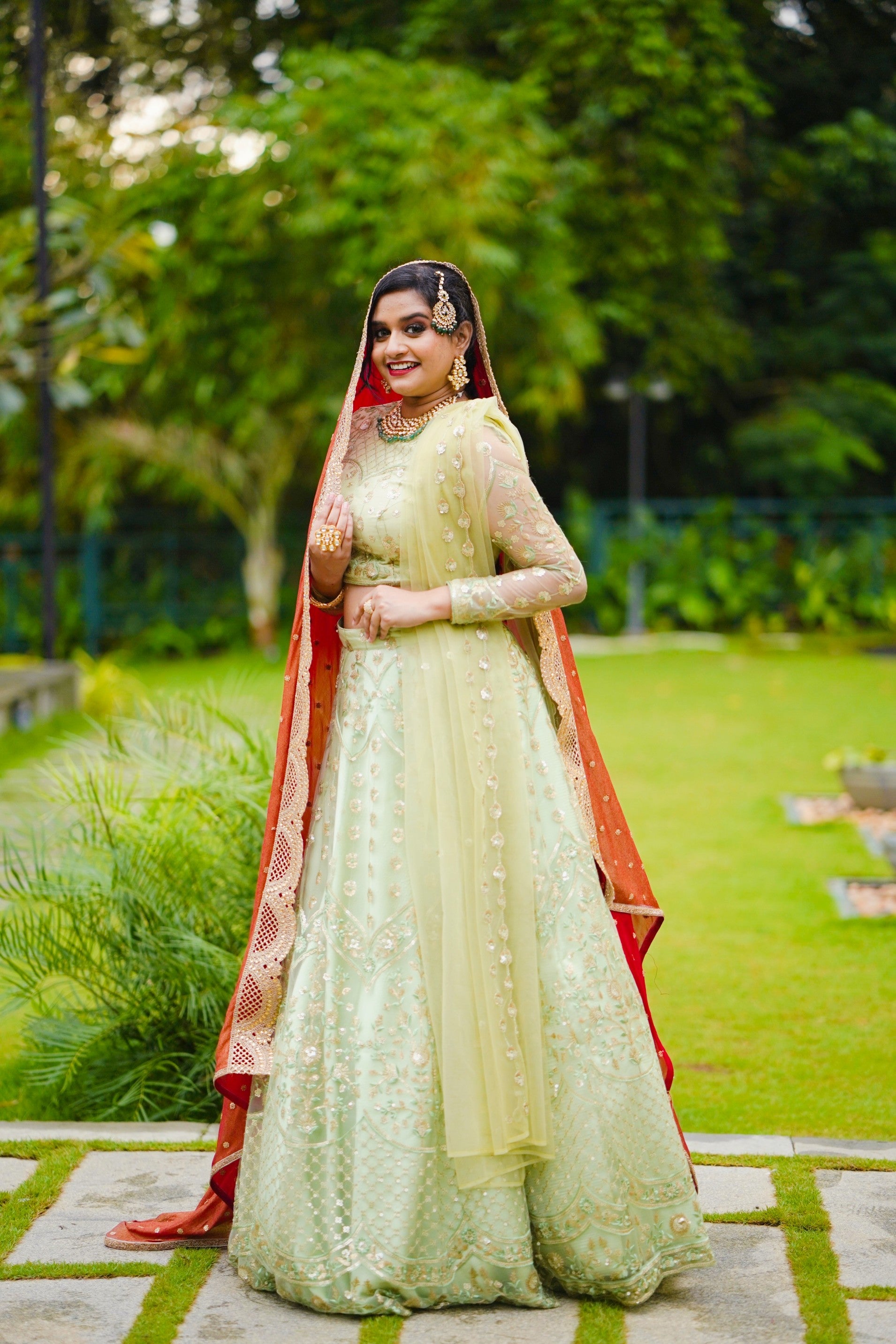 Pastel Green/ Red Bridal Lehenga Detailed with Light Gold Embroidery