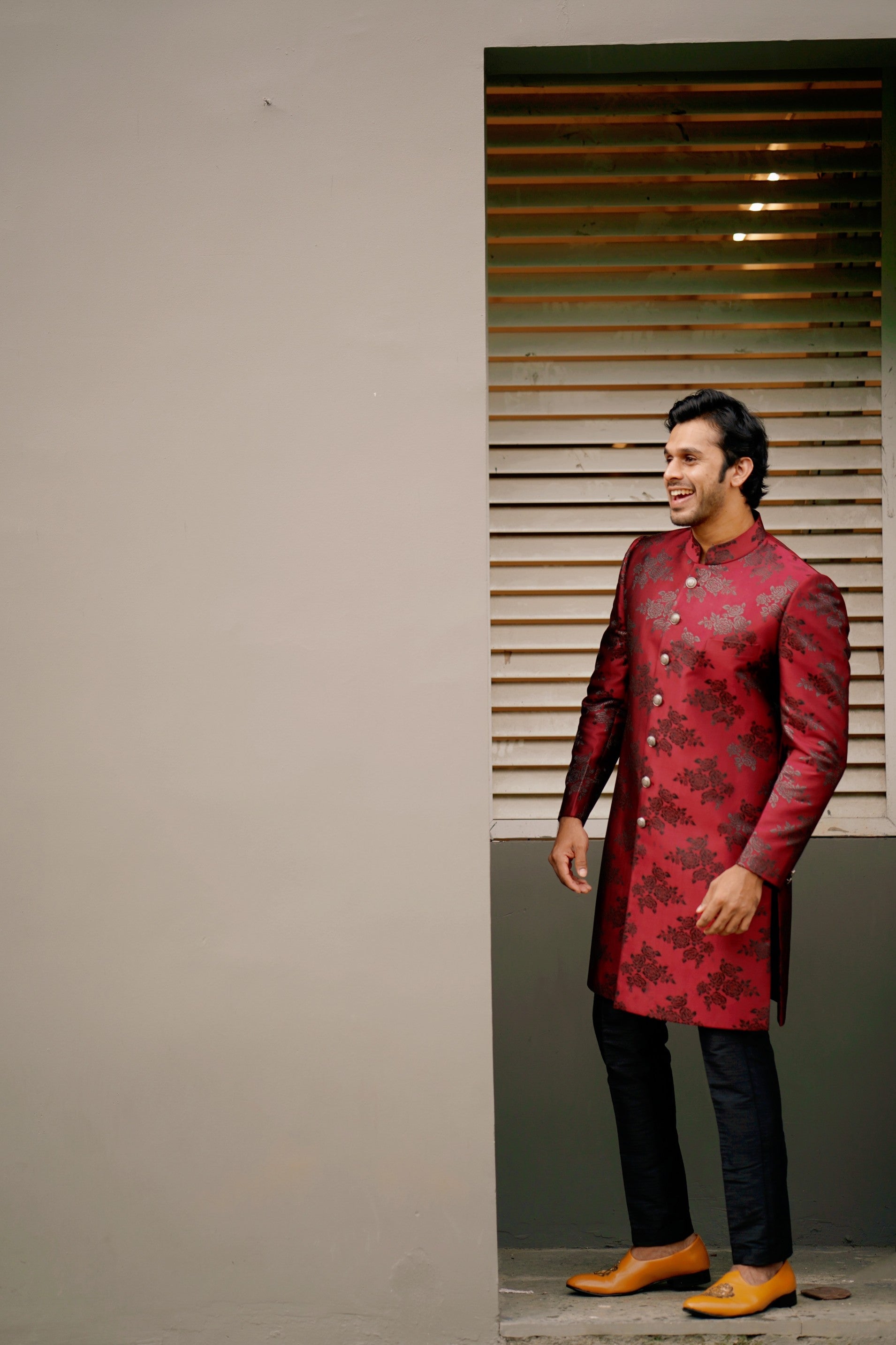 Floral Print Sangria Red Indo Western Slim Achkan Suit paired with Black Naroow Pants