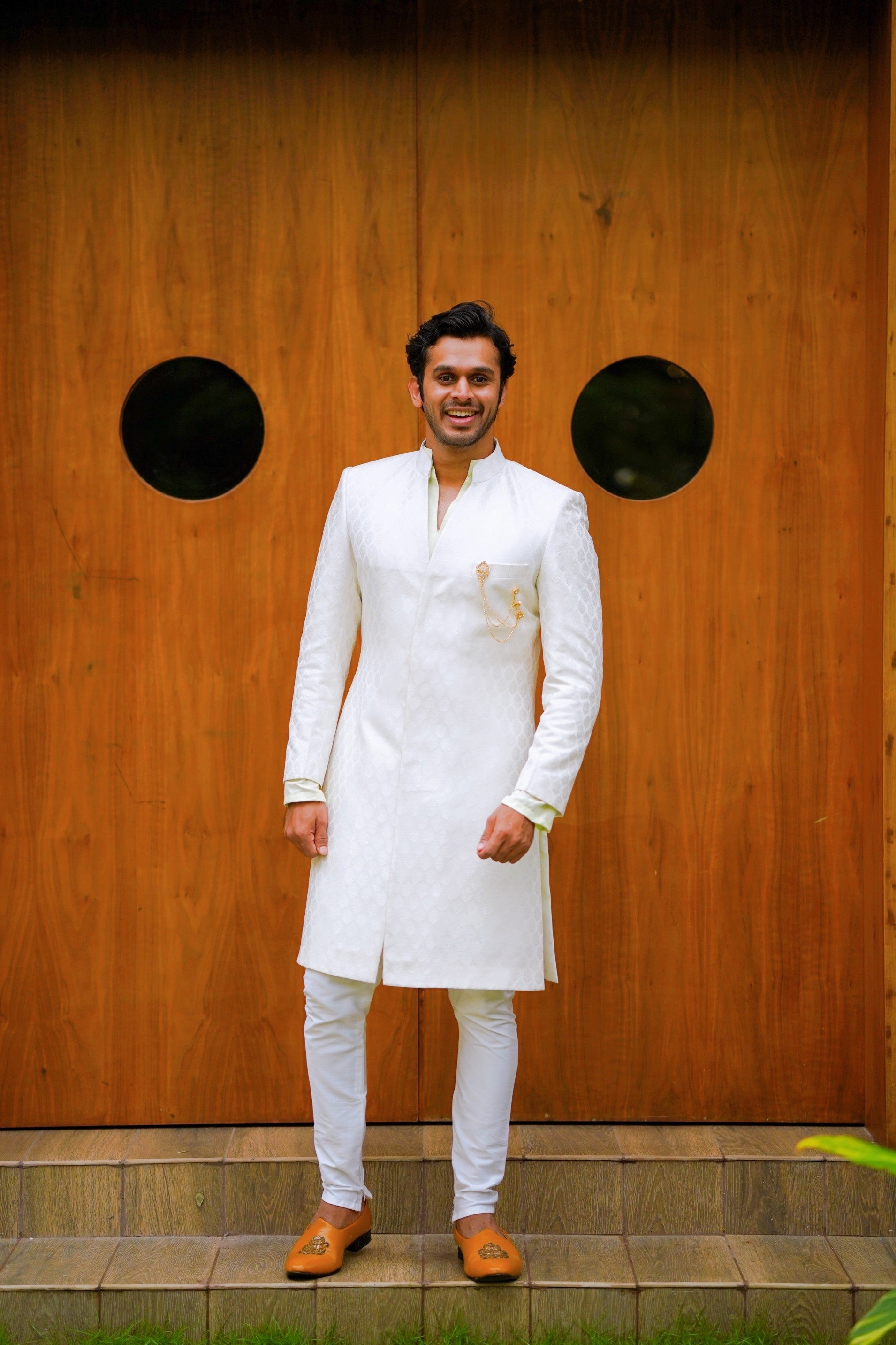 Off White Brocade Indo Western Slim Achkan Suit paired with White Kurta & White Narrow Pants