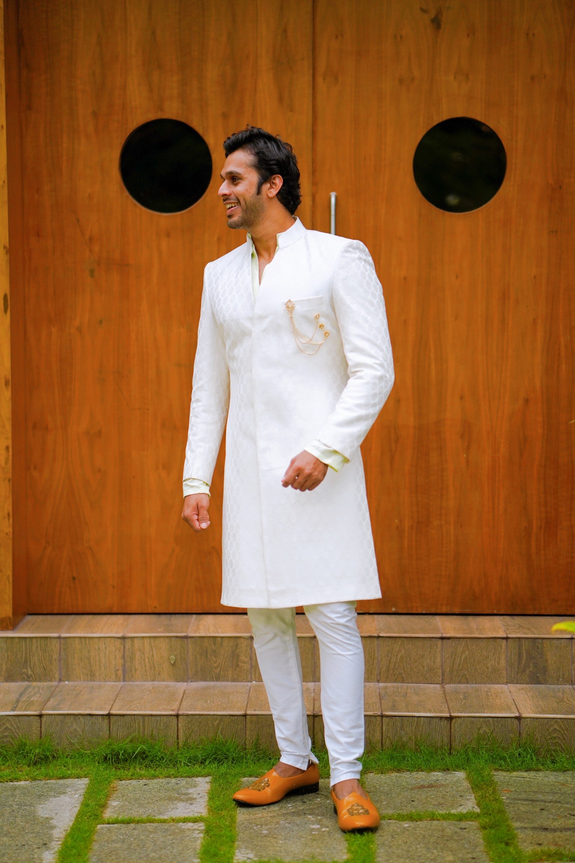 Off White Brocade Indo Western Slim Achkan Suit paired with White Kurta & White Narrow Pants