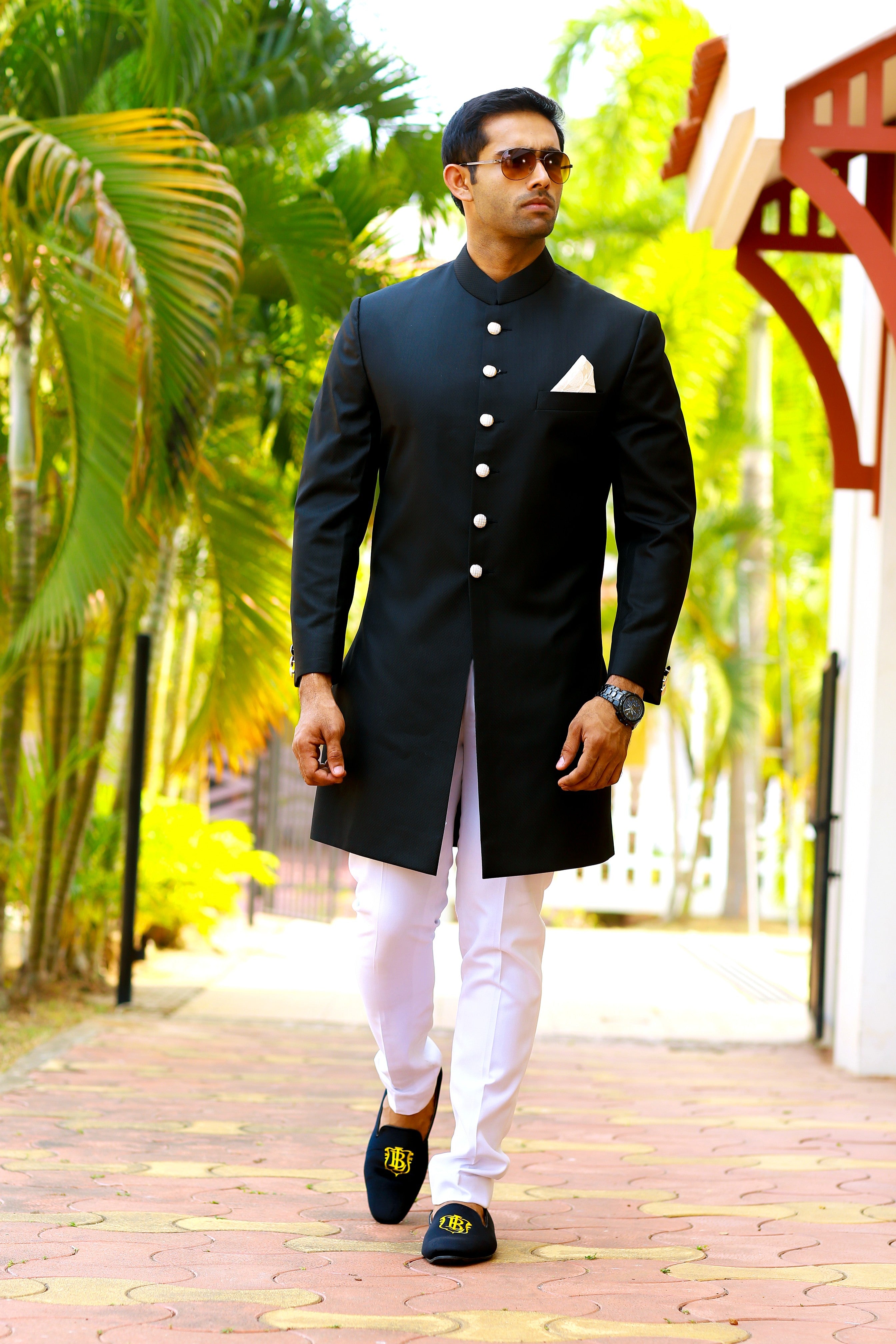 Jet Black Indo Western Slim Achkan Suit  paired with White Narrow Pants (Set of 2)