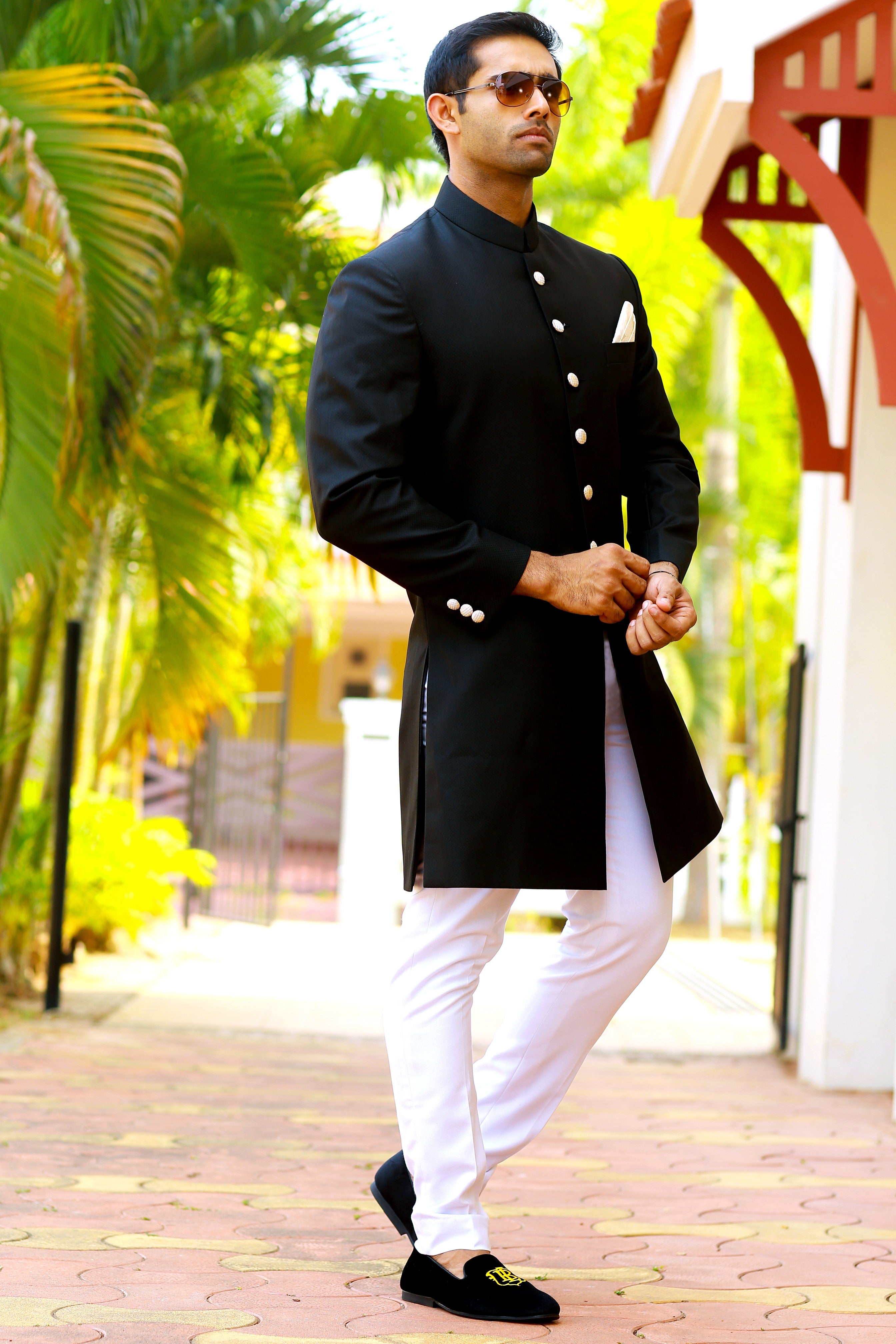 Jet Black Indo Western Slim Achkan Suit paired with White Narrow Pants