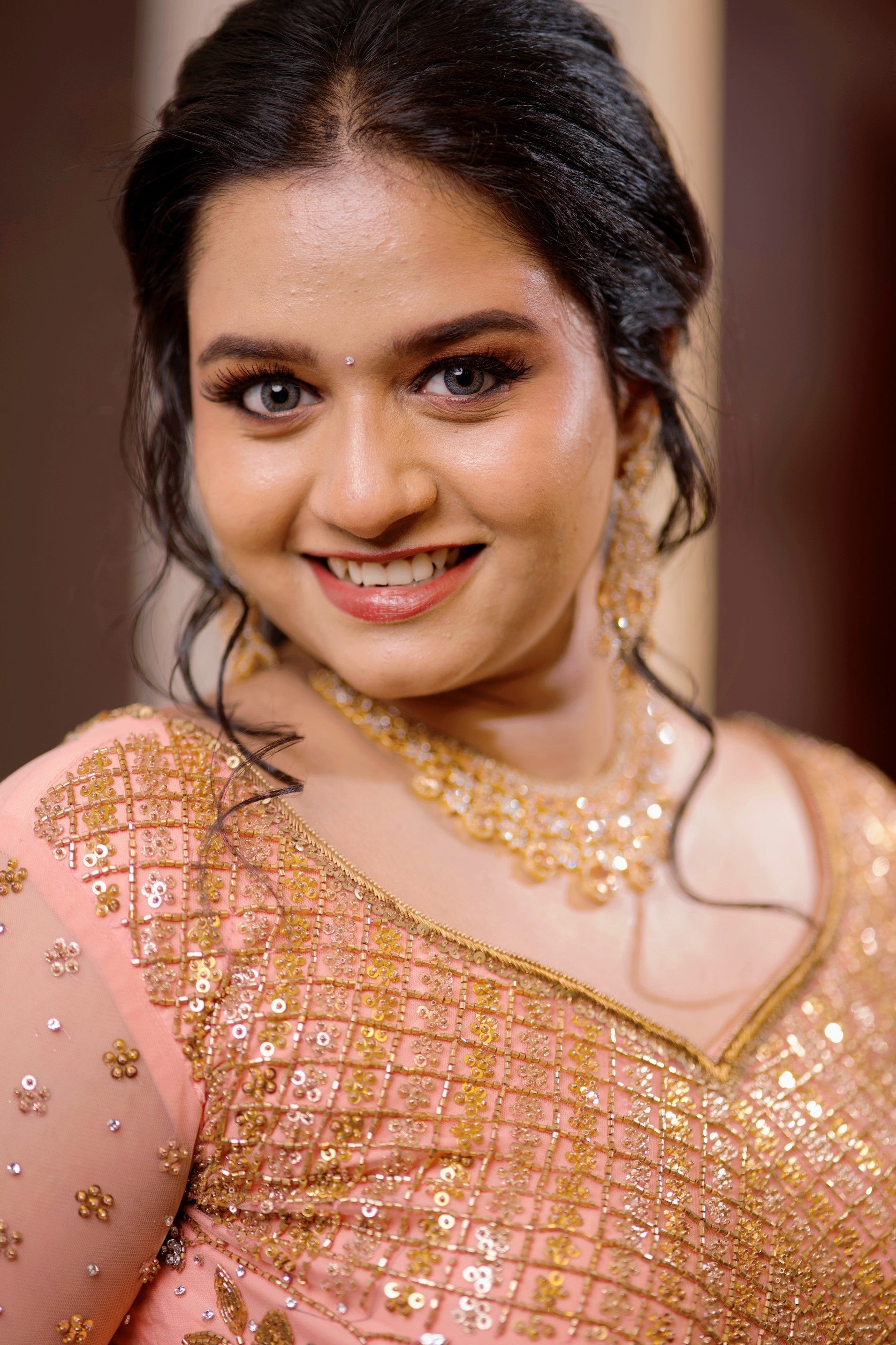 Peach Bridal Lehenga Detailed with Golden Zardozi & Sequence Work