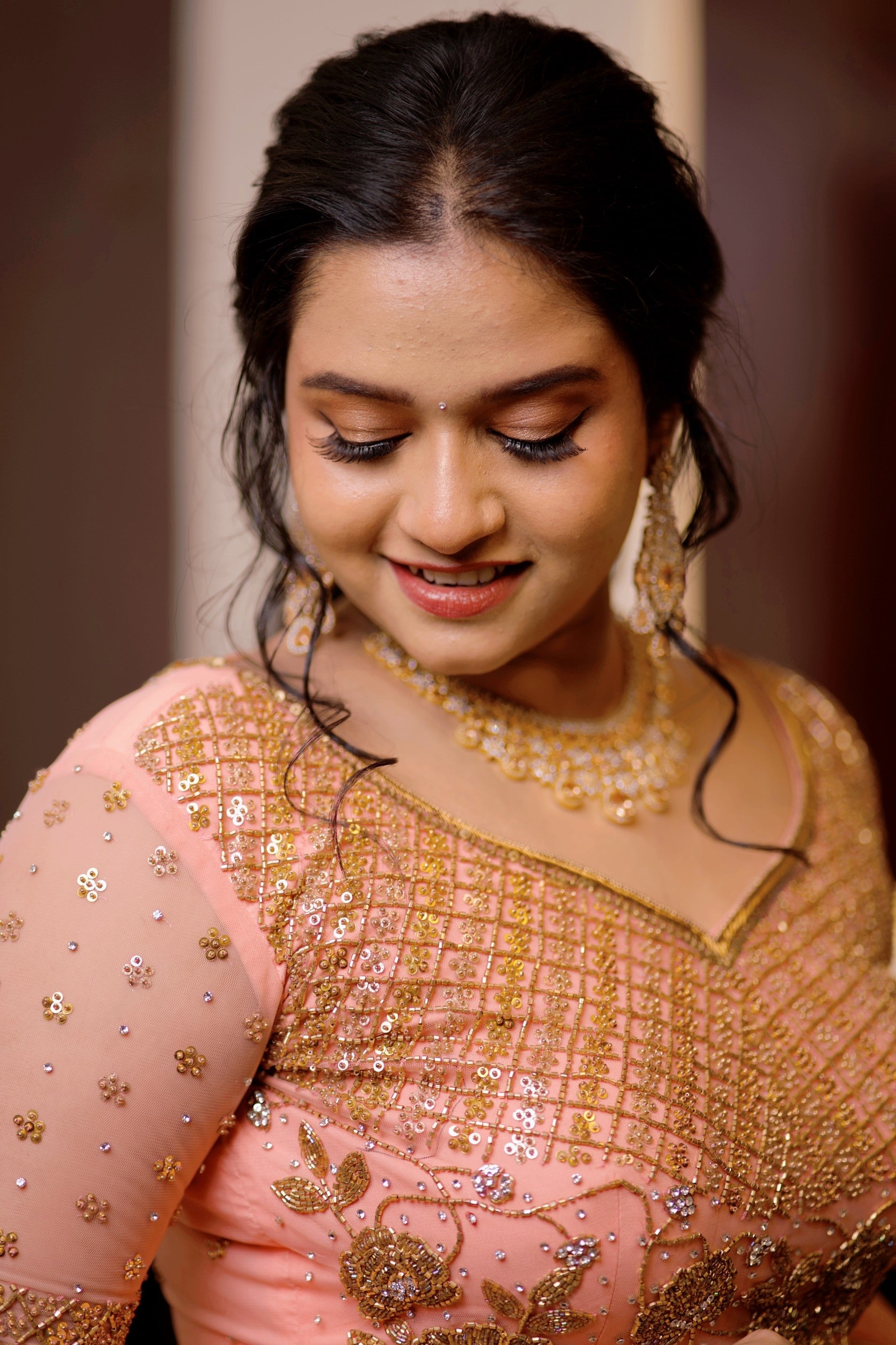 Peach Bridal Lehenga Detailed with Golden Zardozi & Sequence Work