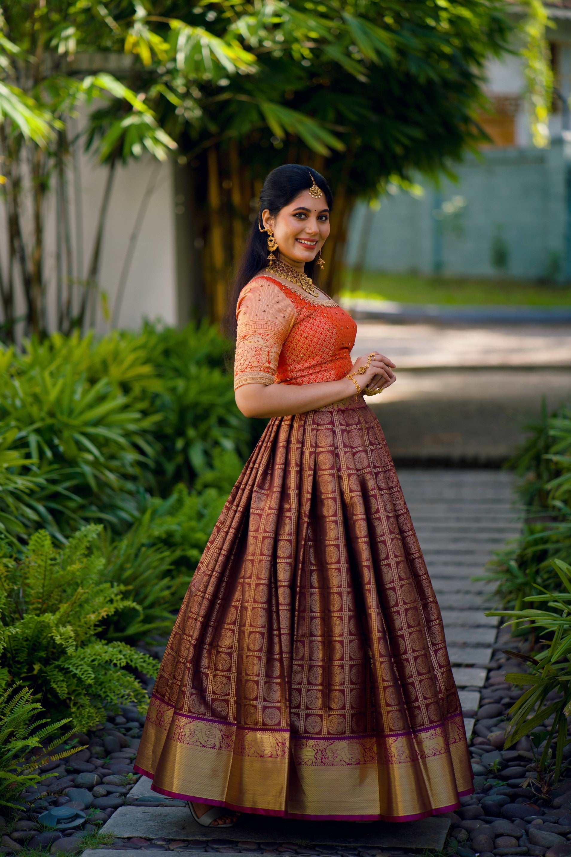 Fire Orange Traditional Lehenga detailed with Golden Highlight Embroidery