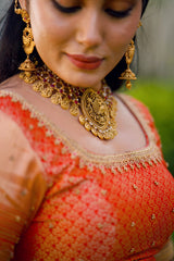 Fire Orange Traditional Lehenga detailed with Golden Highlight Embroidery