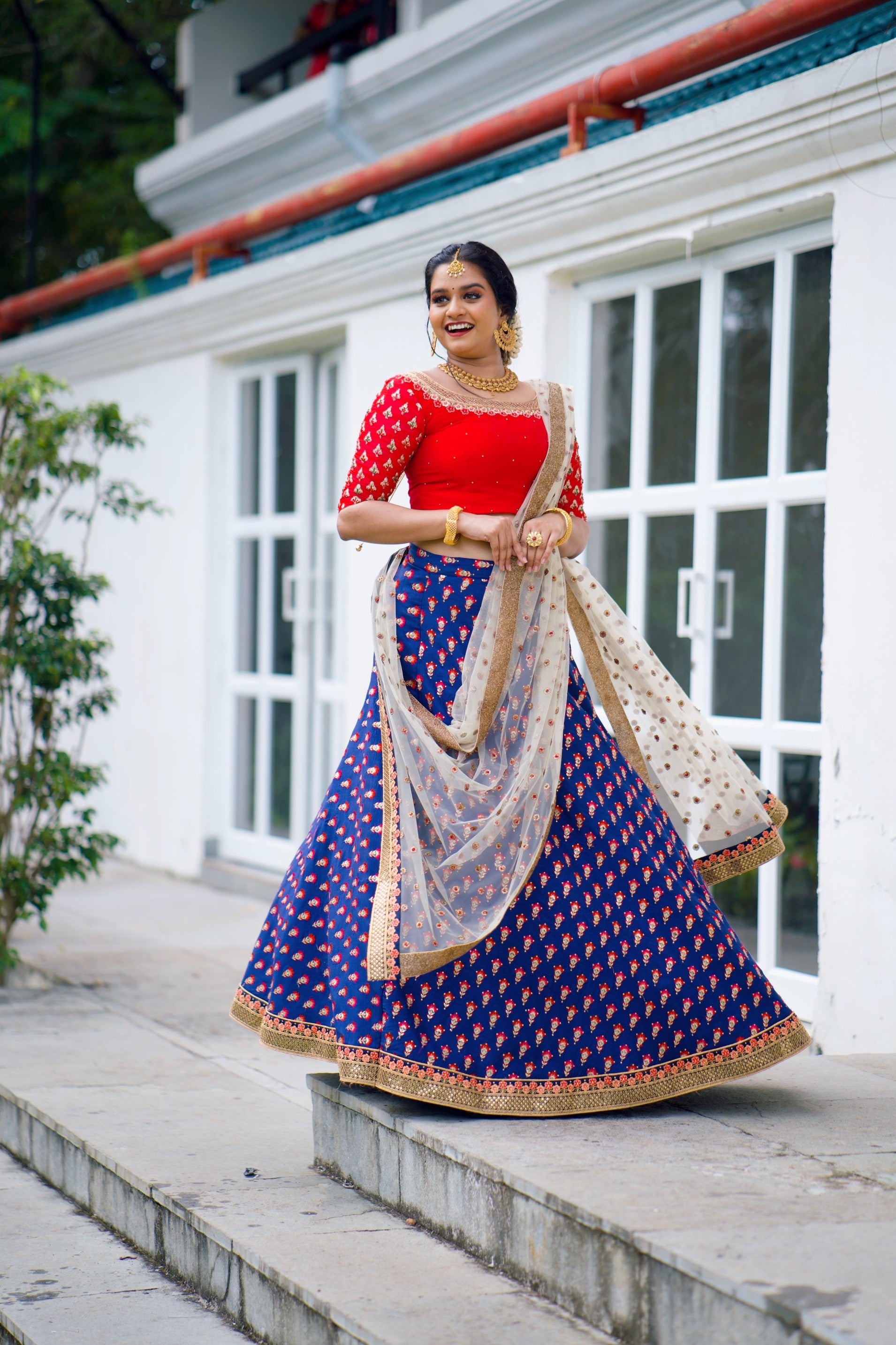 Red/ Blue Traditional Lehenga detailed with Golden Hand Embroidery