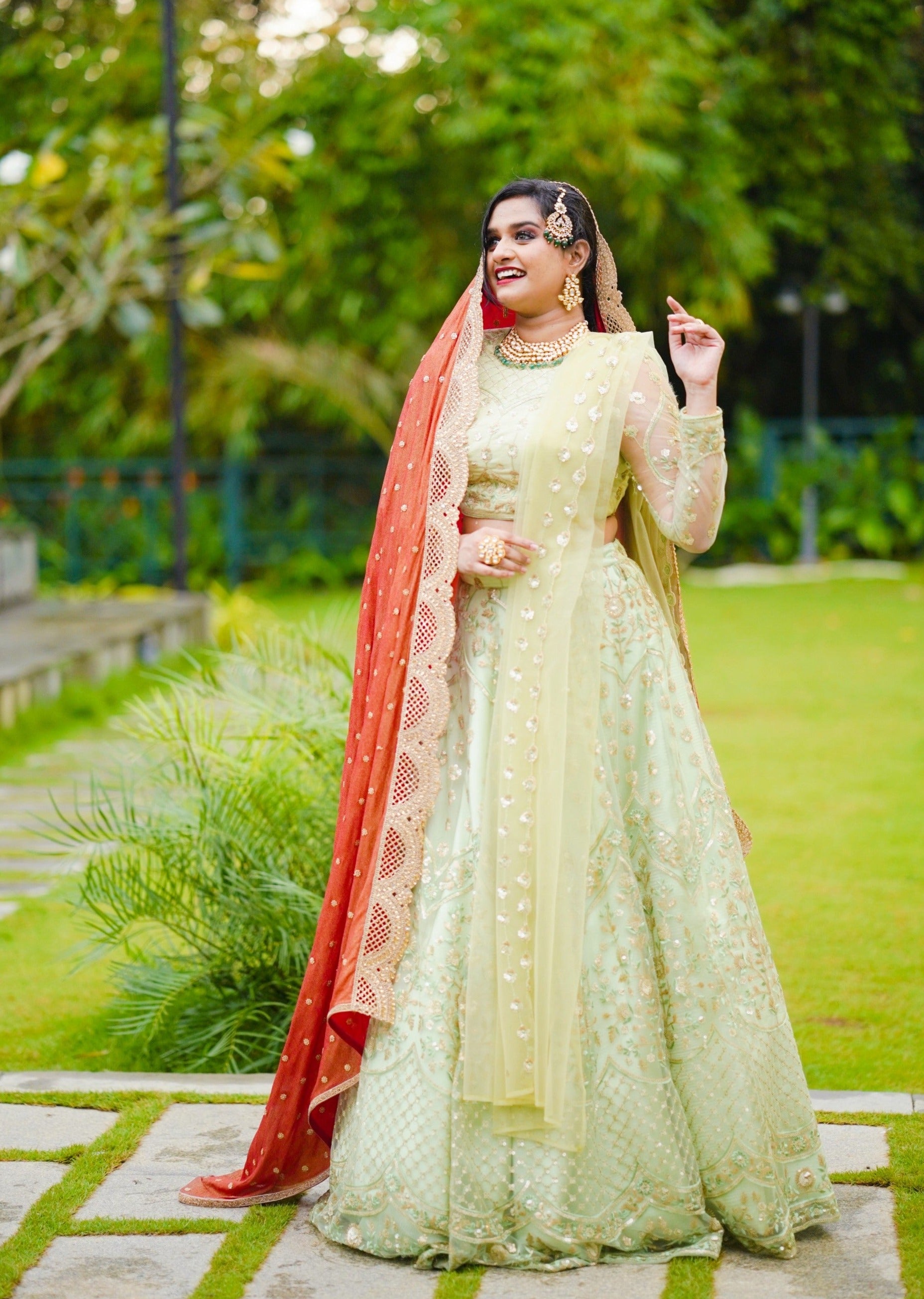 Pastel Green/ Red Bridal Lehenga Detailed with Light Gold Embroidery