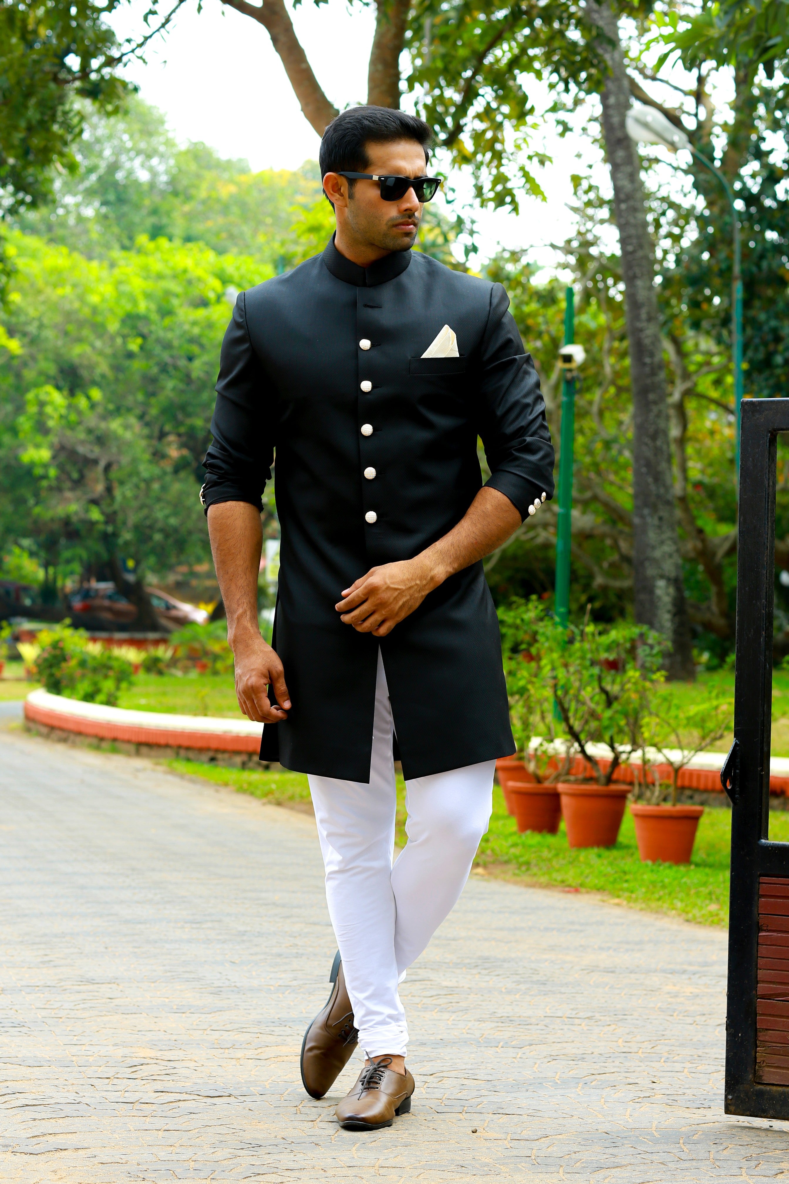 Jet Black Indo Western Slim Achkan Suit  paired with White Narrow Pants